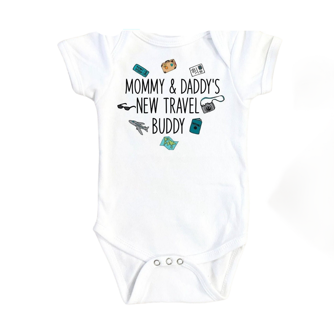 a white baby bodysuit with the words mommy and daddy's new travel buddy