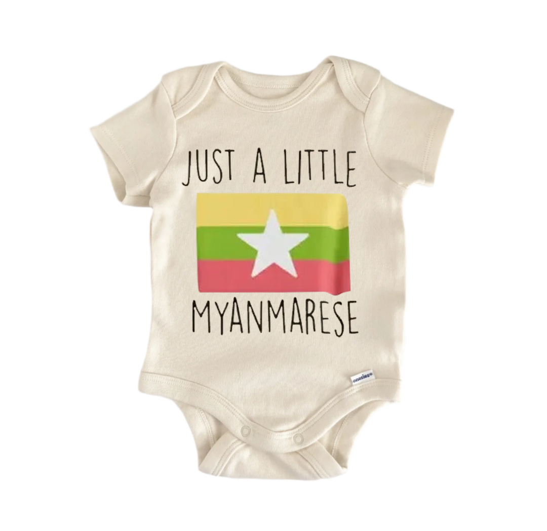 A beige baby onesie with a printed design and text on it.