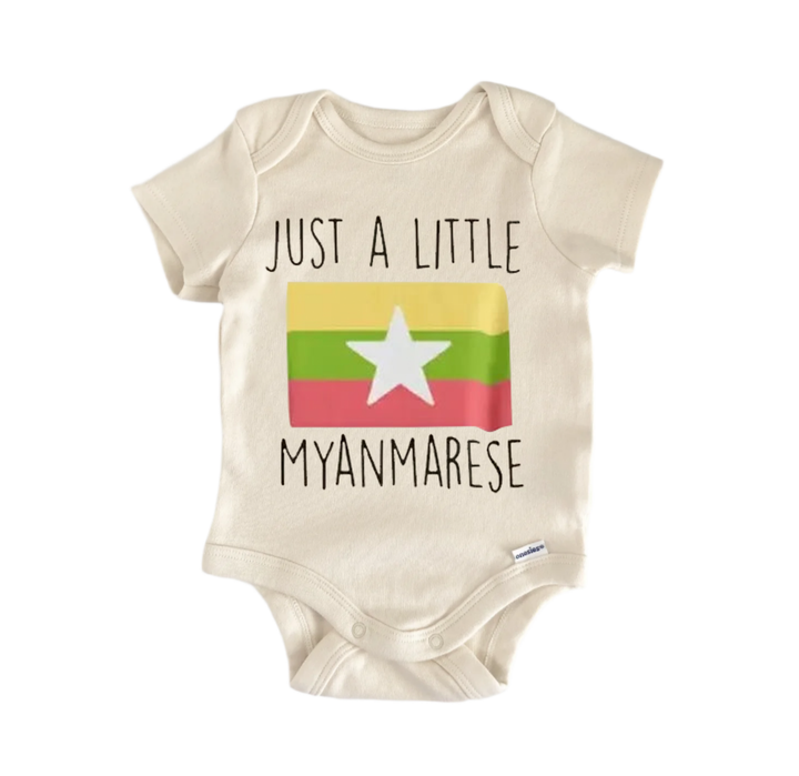 A beige baby onesie with a printed design and text on it.