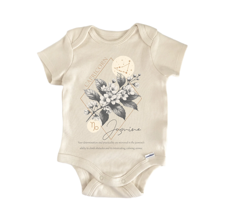 A beige baby onesie with a floral design and text related to the zodiac sign Capricorn.