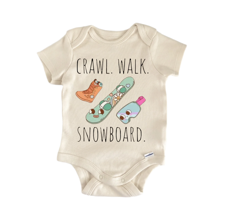 a baby onesie with a playful design of a snowboard and the text "CRAWL. WALK. SNOWBOARD."