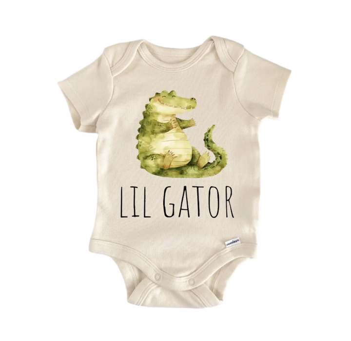 A baby onesie with a green alligator printed on it, and the word "LIL GATOR" printed below the image.