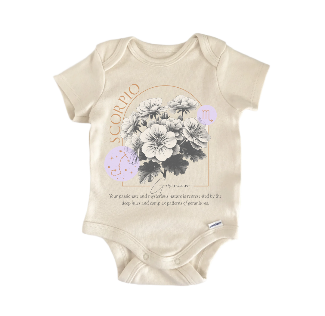 a baby onesie with a floral design and text related to the zodiac sign Scorpio.