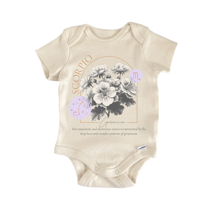 a baby onesie with a floral design and text related to the zodiac sign Scorpio.