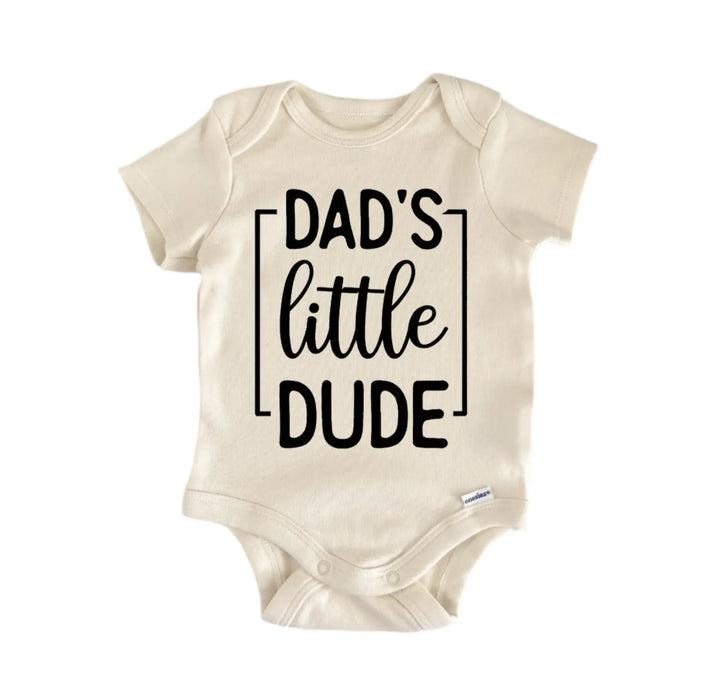 A beige baby onesie with the text "DAD&