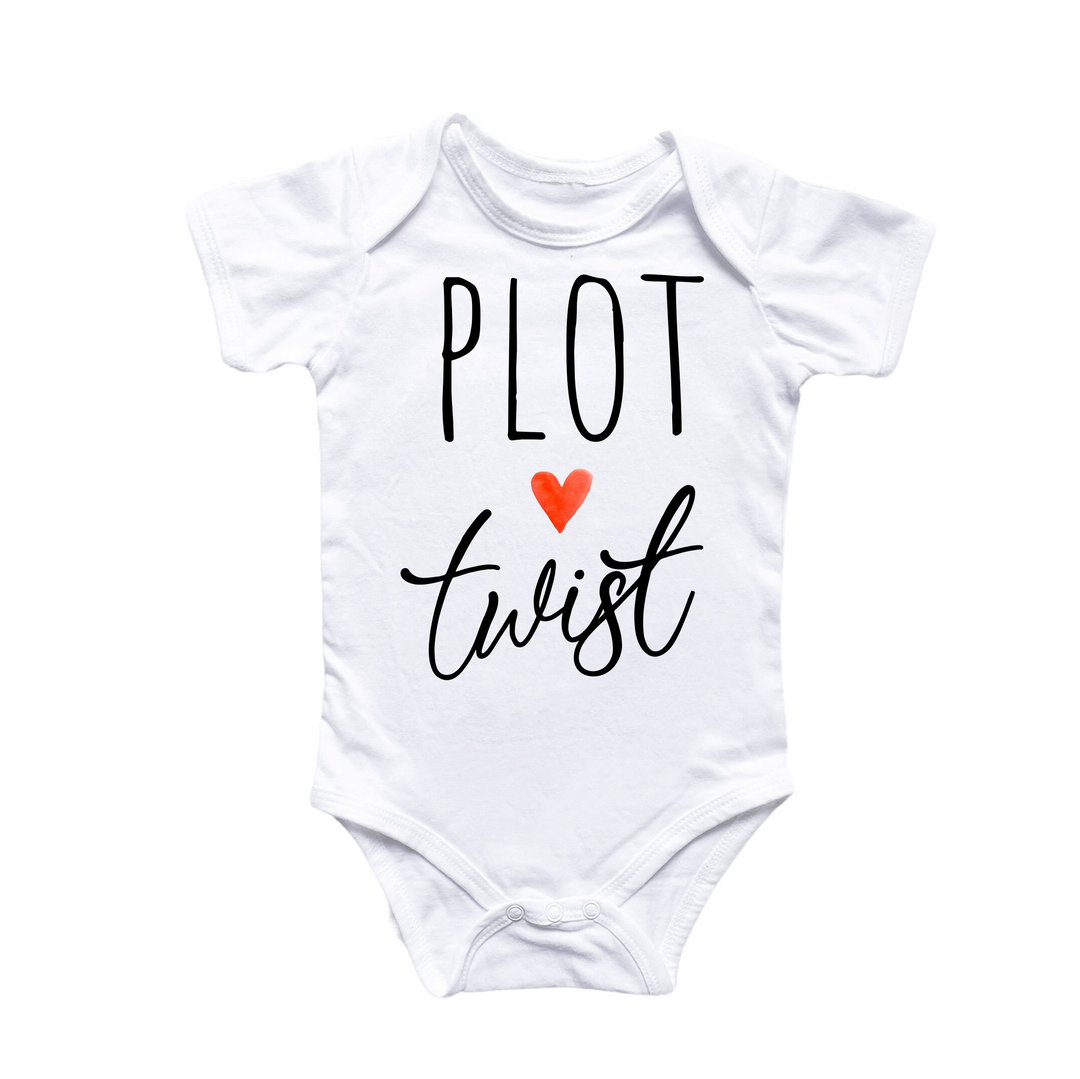 a white bodysuit with a red heart that says plot first