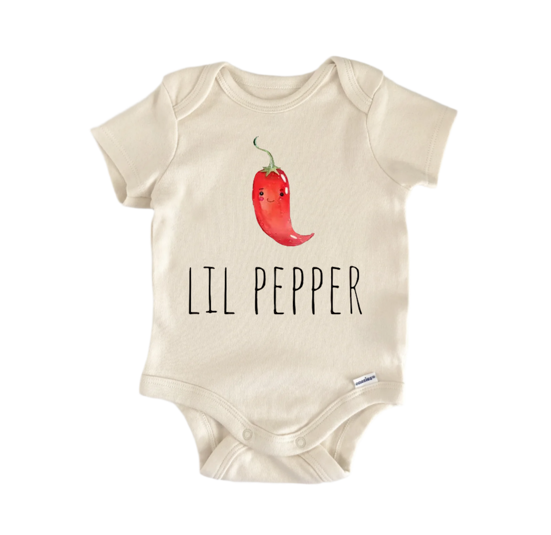 A beige baby onesie with a red chili pepper graphic and the text "LIL PEPPER" printed on it.