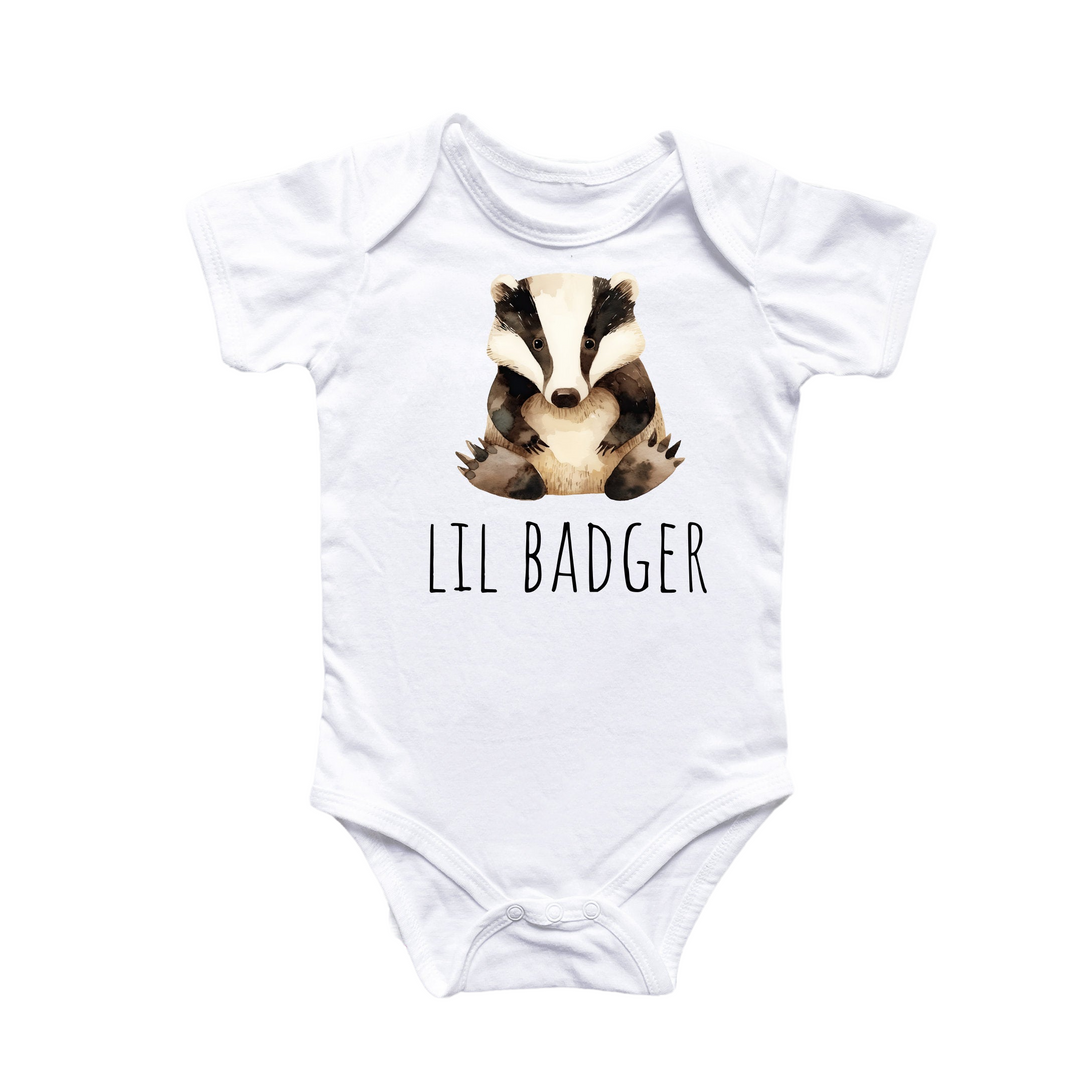 a white bodysuit with a badger graphic on it