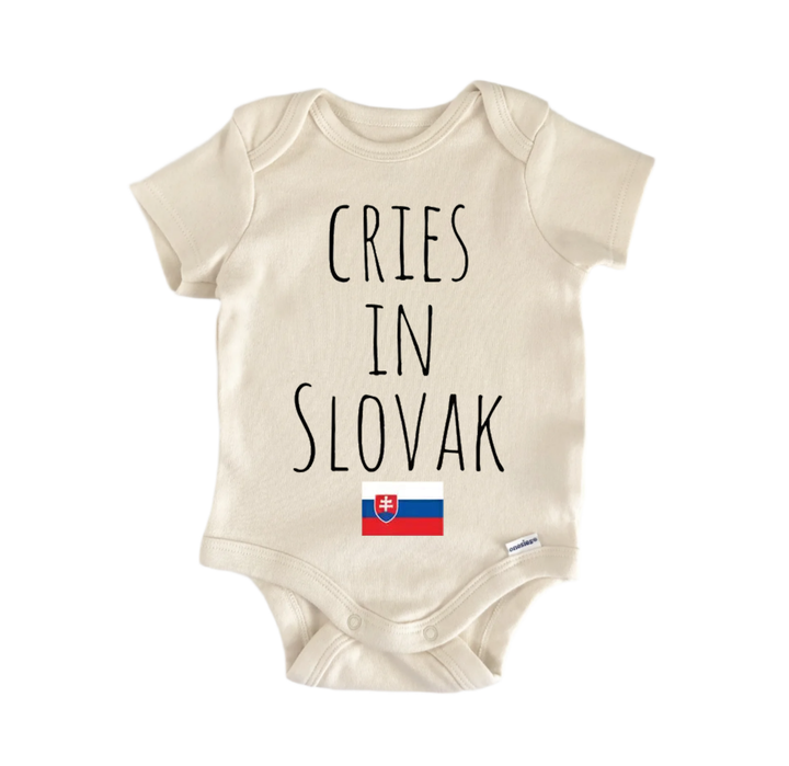 A beige baby onesie with the text "CRIES IN SLOVAK" printed on it, along with a small flag of Slovakia below the text.