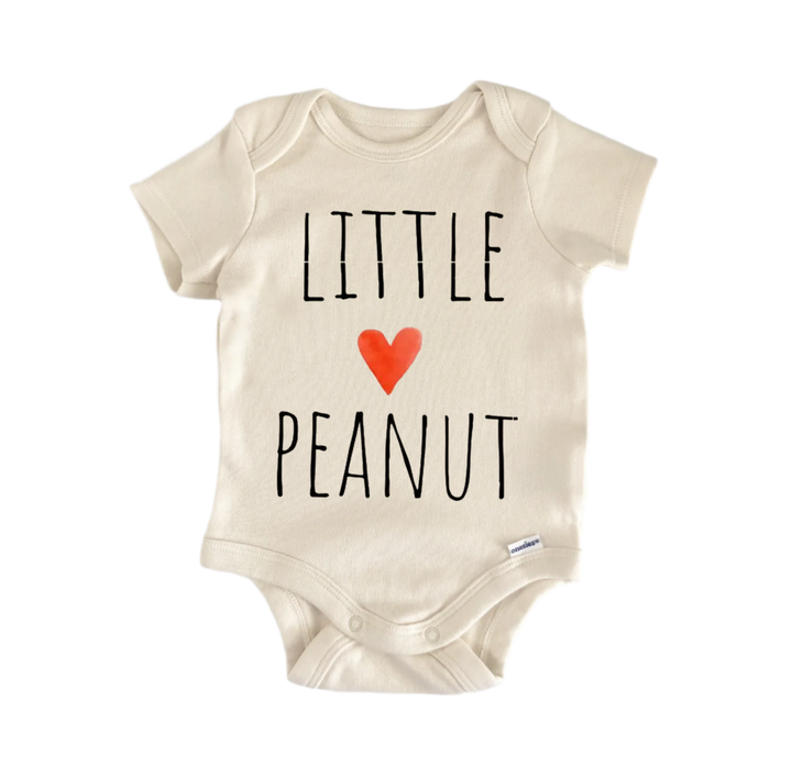 A beige baby onesie with the text "LITTLE PEANUT" printed on it, along with a red heart symbol.