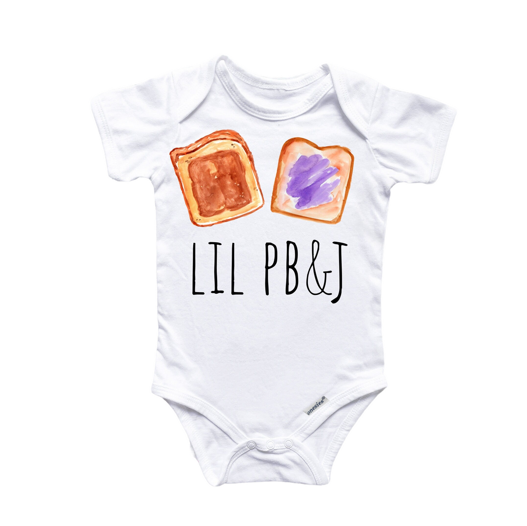 a white baby bodysuit with a toast and jelly on it