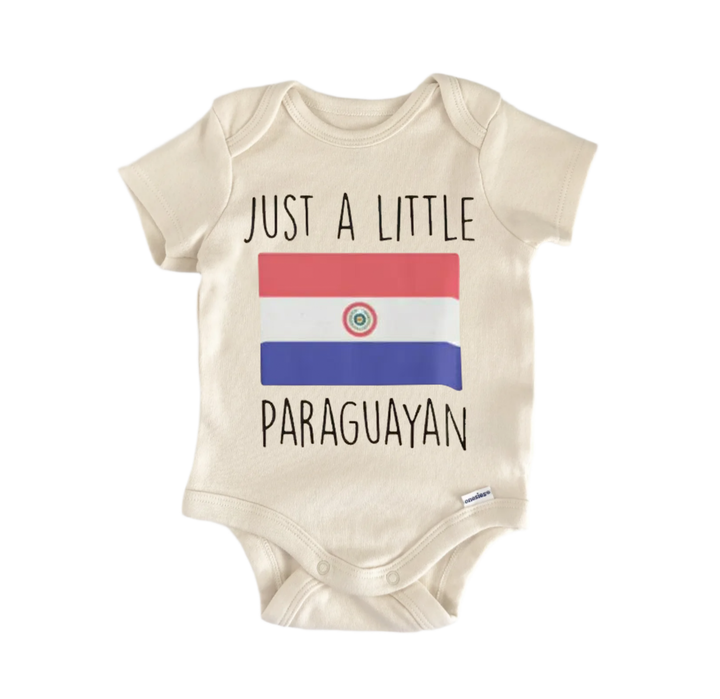 A beige baby onesie with the text "JUST A LITTLE PARAGUAYAN" printed on it, along with the flag of Paraguay.