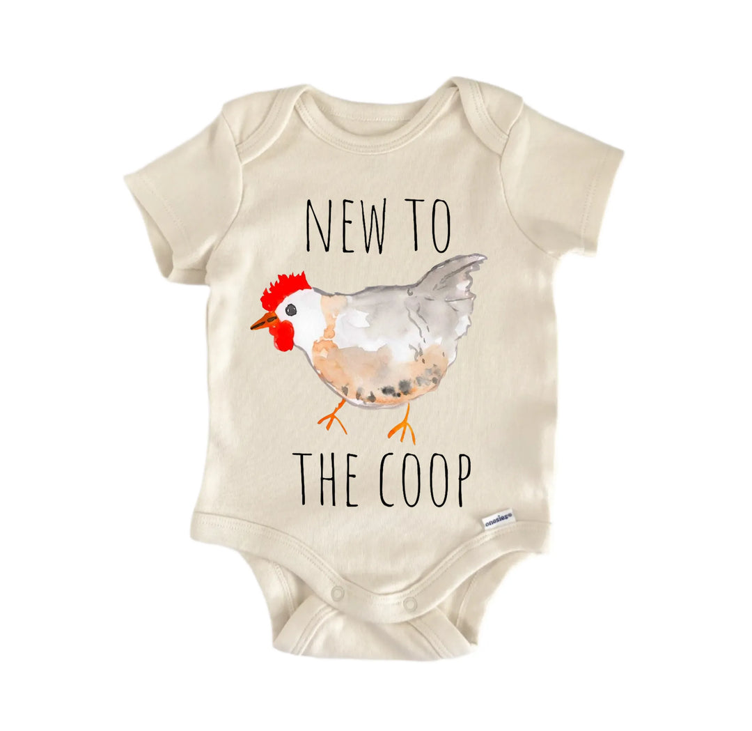 A baby onesie with a printed image of a chicken and the text "NEW TO THE COOP" printed on it.