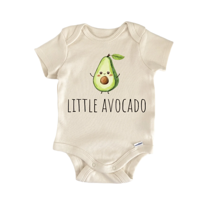 A beige baby onesie with a printed avocado graphic and the text "LITTLE AVOCADO" printed on it.