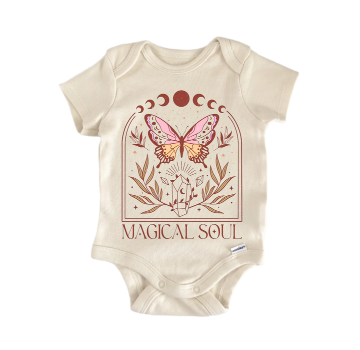 A beige baby onesie with a graphic design featuring a butterfly, moon phases, and the text "MAGICAL SOUL".