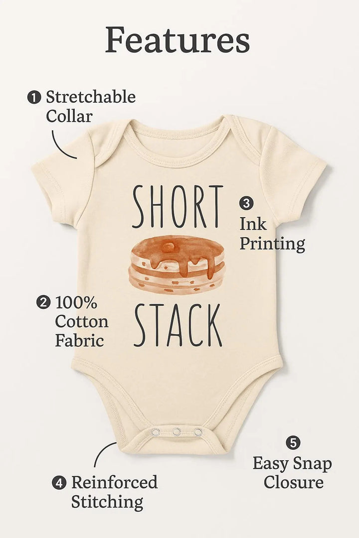 a baby onesie with a short neckline and a pancake design printed on it. The onesie has a stretchable collar, 100% cotton fabric, a reinforced stitching, and an easy snap closure.