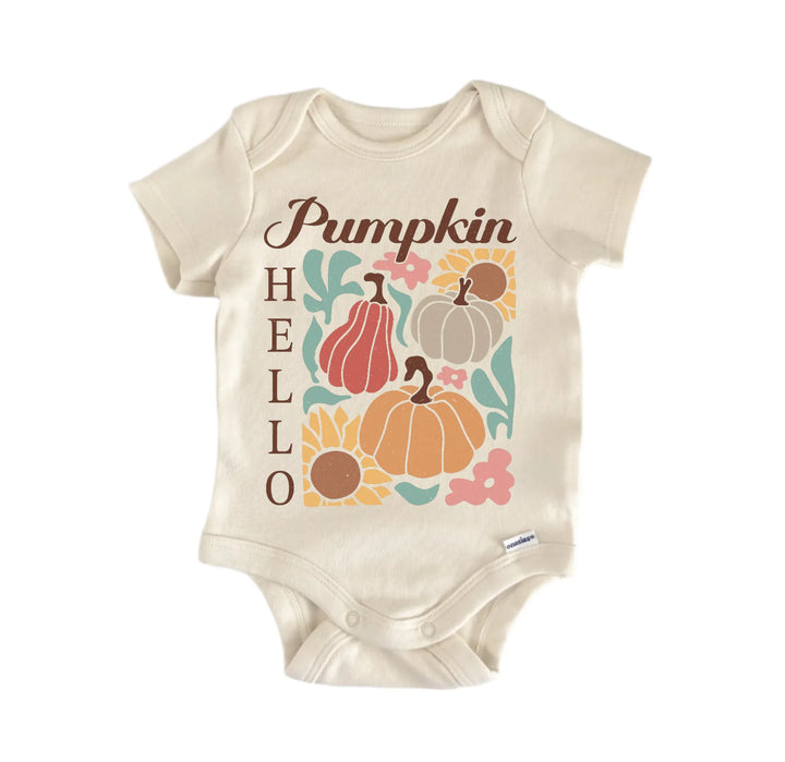 A beige baby onesie with a graphic design featuring pumpkins and the word "Pumpkin" written on it.