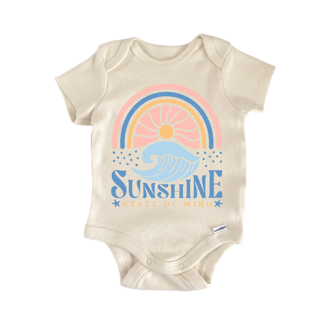 A beige baby onesie with a graphic design featuring a rainbow, waves, and the text "Sunshine State of Mind".
