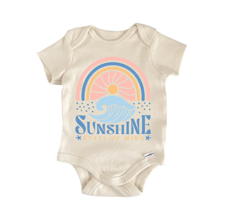 A beige baby onesie with a graphic design featuring a rainbow, waves, and the text "Sunshine State of Mind".