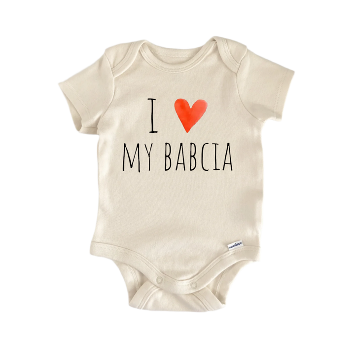 A beige baby onesie with the text "I ♥ MY BABCIA" printed on it.