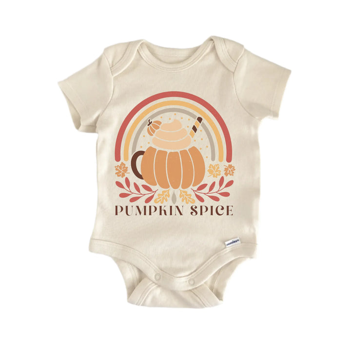 A beige baby onesie with a graphic design featuring a pumpkin, a teapot, and a rainbow. The text below the design says "PUMPKIN SPICE".