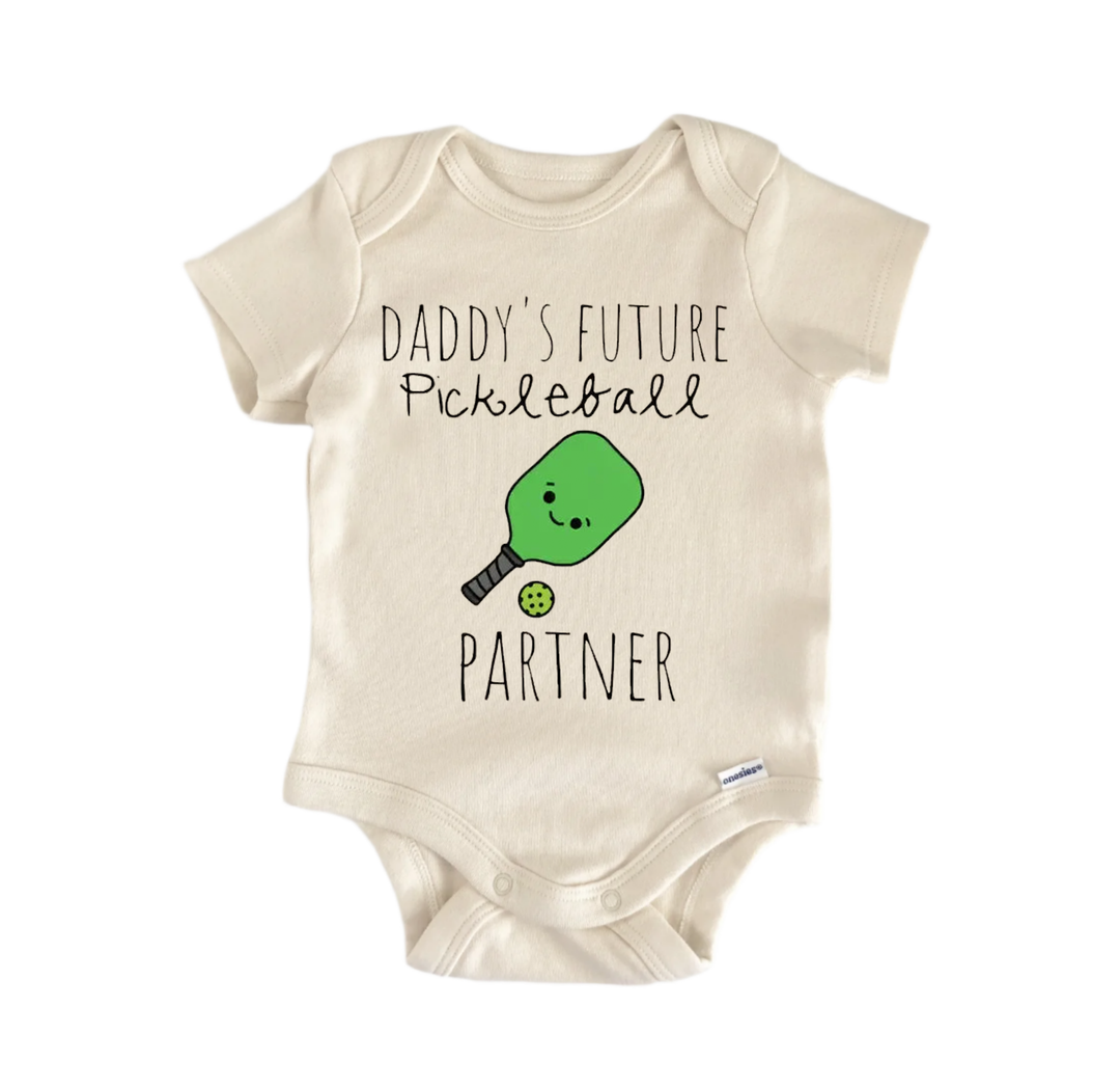 A beige baby onesie with a playful graphic design and text printed on it.