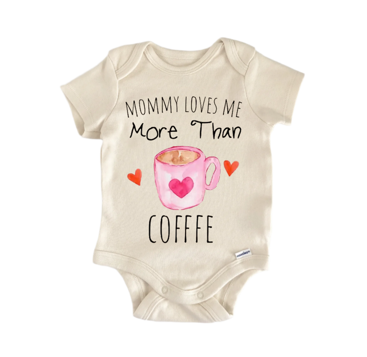 a baby onesie with a printed message that reads "Mommy loves me more than coffee".
