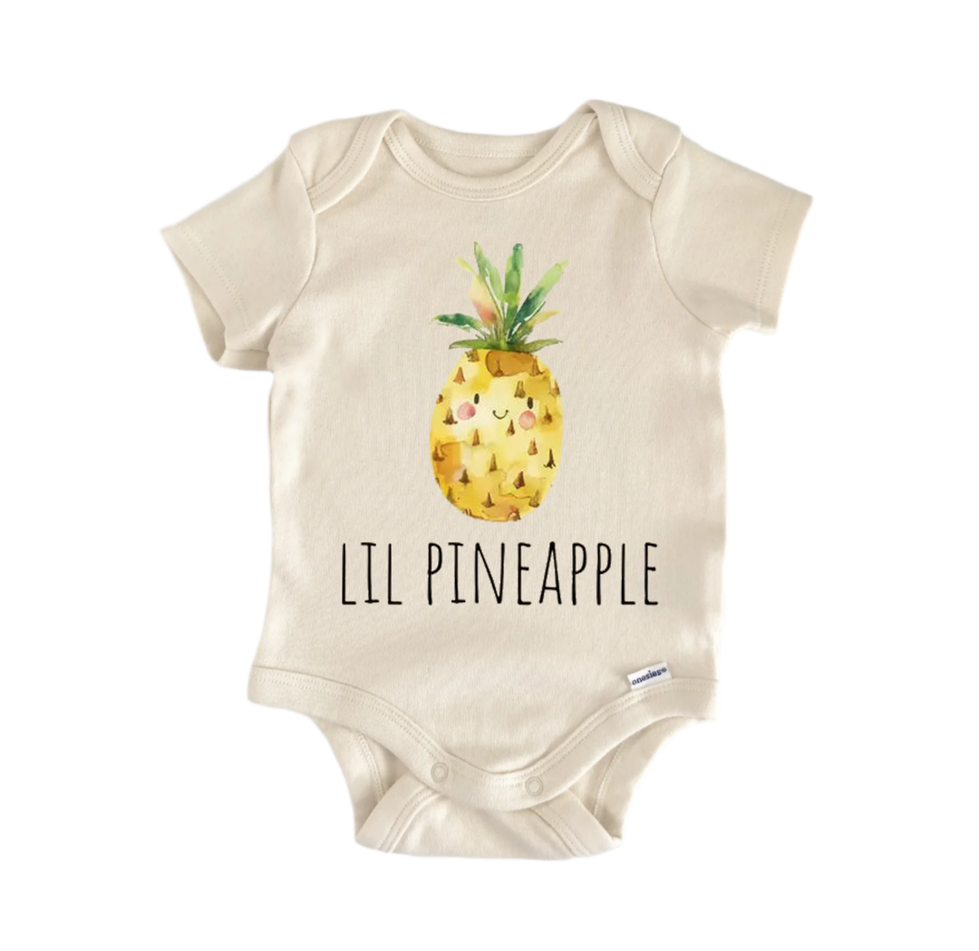 A beige baby onesie with a printed pineapple design and the text "LIL PINEAPPLE" printed on it.