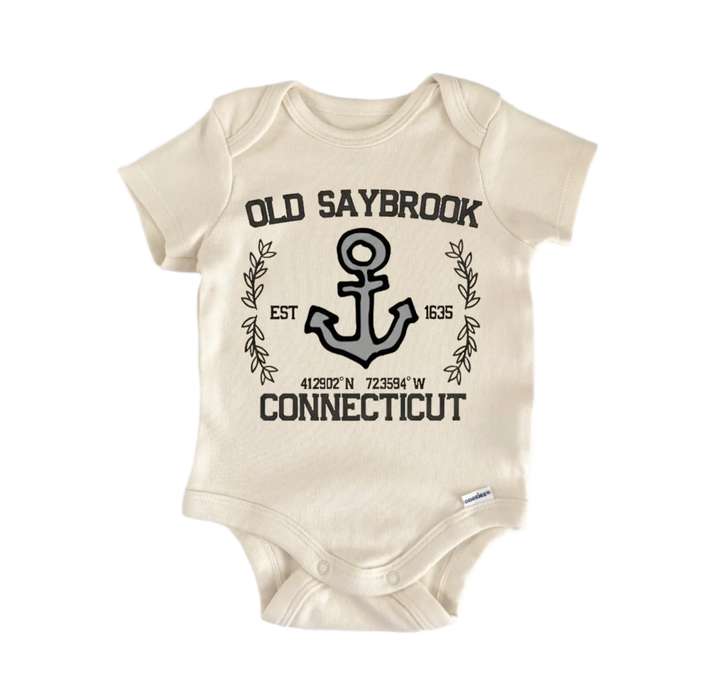 A beige baby onesie with a graphic design featuring an anchor and the text "OLD SAYBROOK EST 1635 CONNECTICUT".
