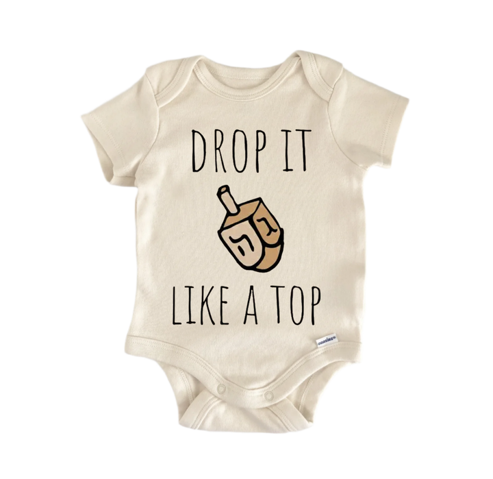 a beige baby onesie with a playful graphic and text printed on it.