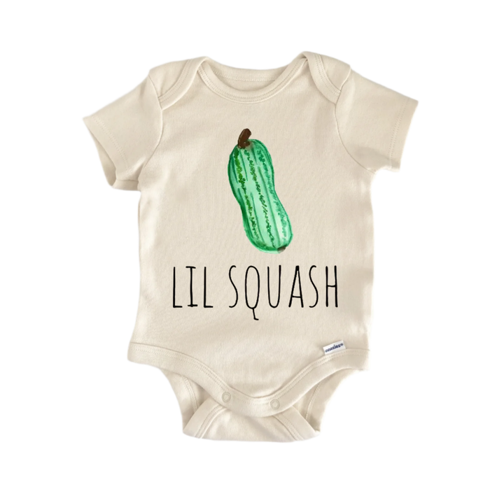 A beige baby onesie with a green squash graphic and the text "LIL SQUASH" printed on it.