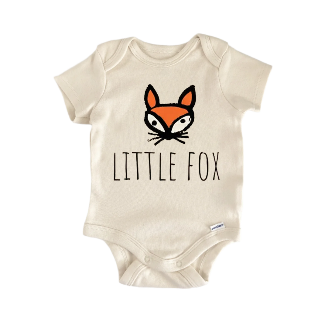 A beige baby onesie with a cartoon fox design and the text "LITTLE FOX" printed on it.