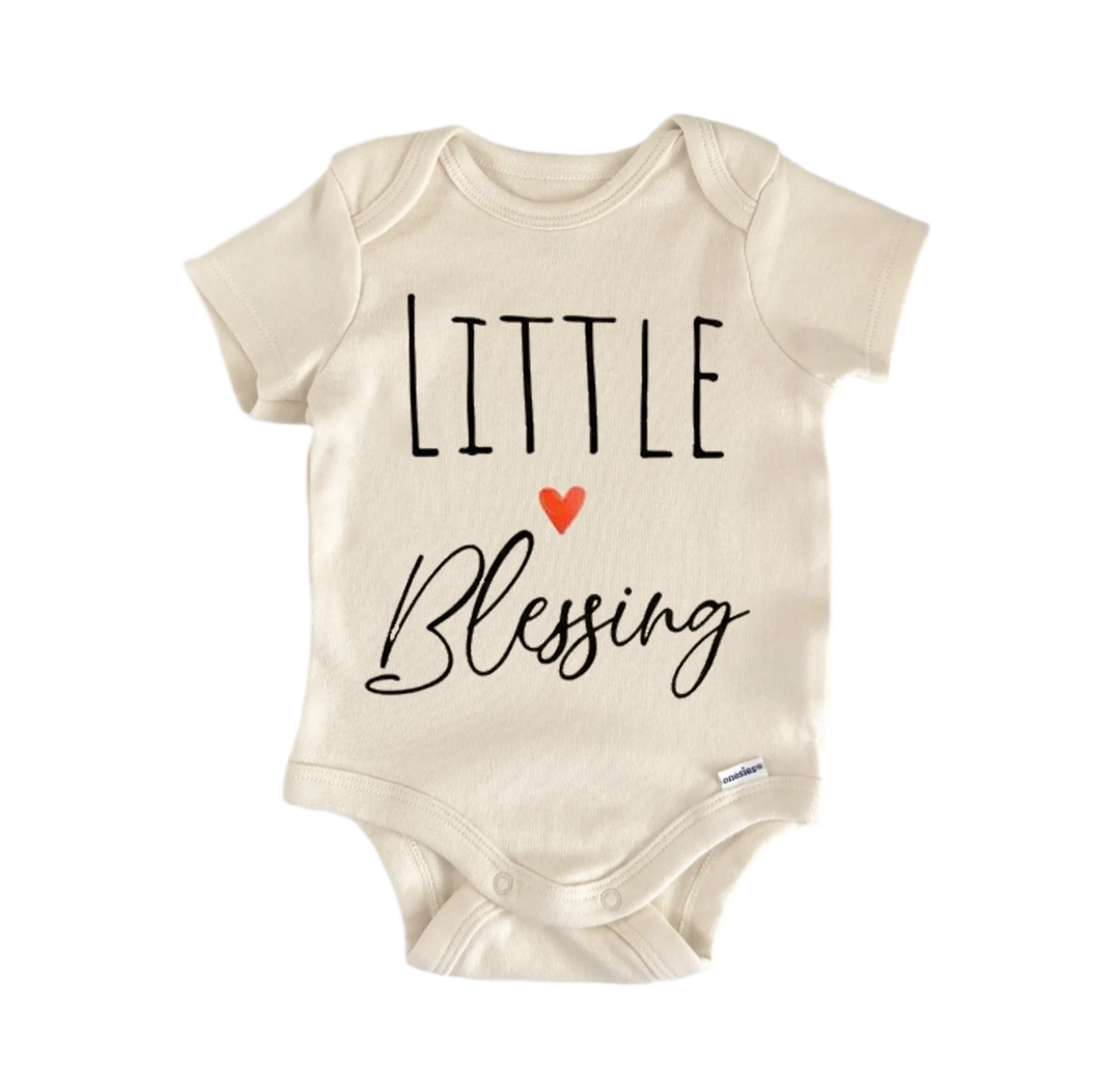 A beige baby onesie with the text "LITTLE BLESSING" printed on it.
