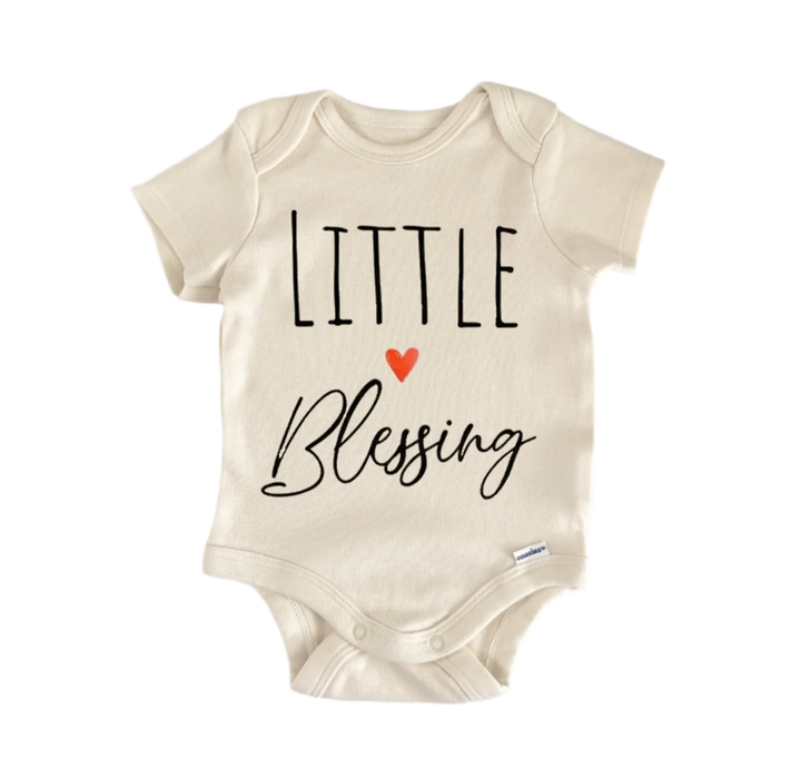 A beige baby onesie with the text "LITTLE BLESSING" printed on it.