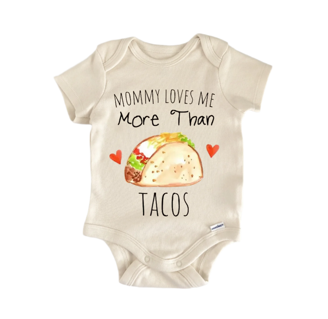 A baby onesie with a printed design of a taco and the text "Mommy loves me more than tacos" printed on it.