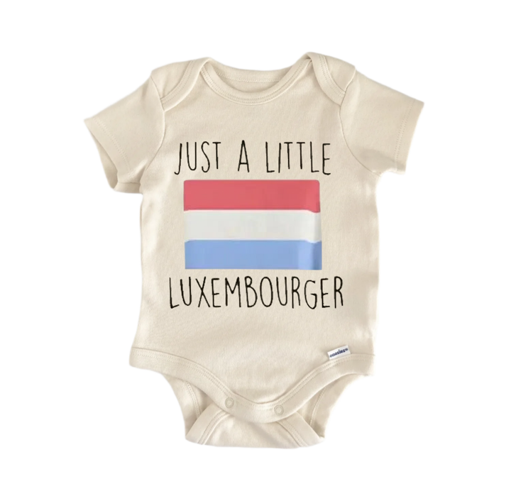 A beige baby onesie with the text "JUST A LITTLE LUXEMBOURGER" printed on it, along with a small flag design.