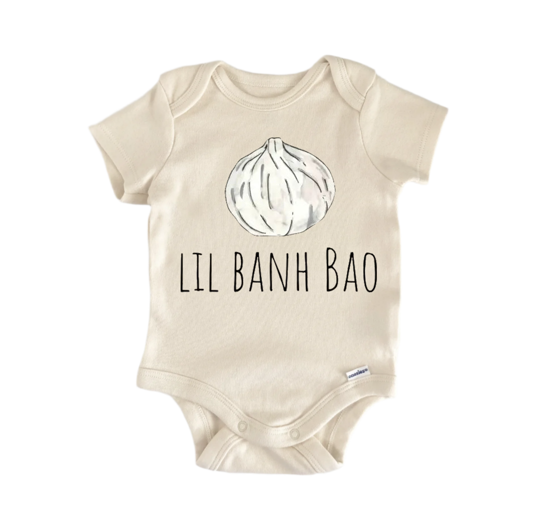 A beige baby onesie with a graphic of a garlic bulb and the text "LIL BANH BÃO" printed on it.
