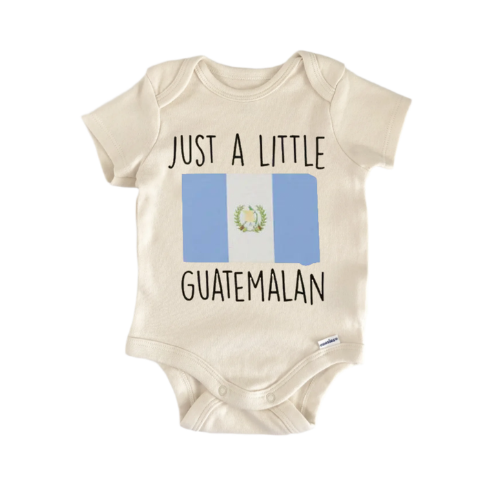 A beige baby onesie with the text "JUST A LITTLE GUATEMALAN" printed on it, along with a small image of the Guatemala flag.