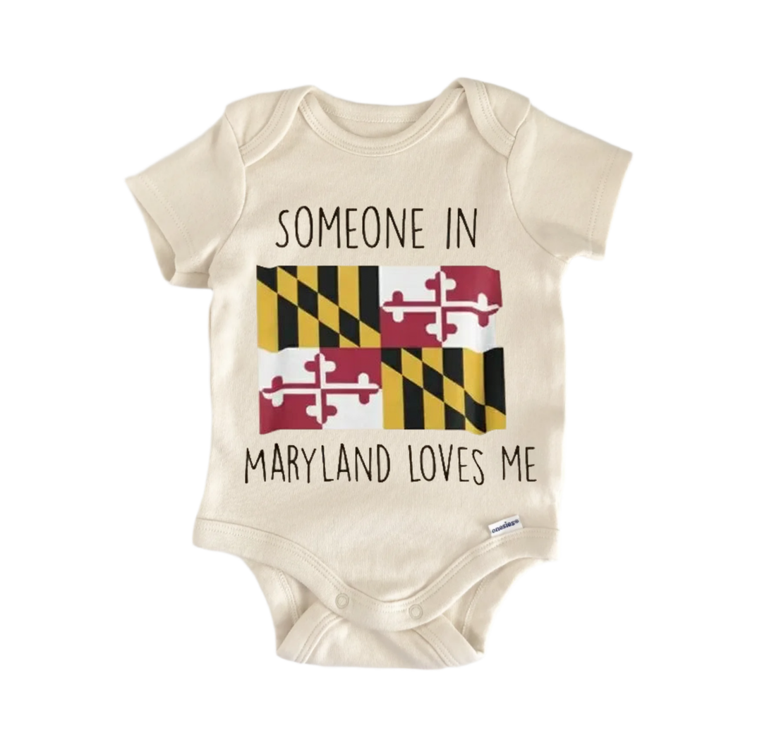 A beige baby onesie with a graphic design of the Maryland state flag and the text "SOMEONE IN MARYLAND LOVES ME" printed on it.