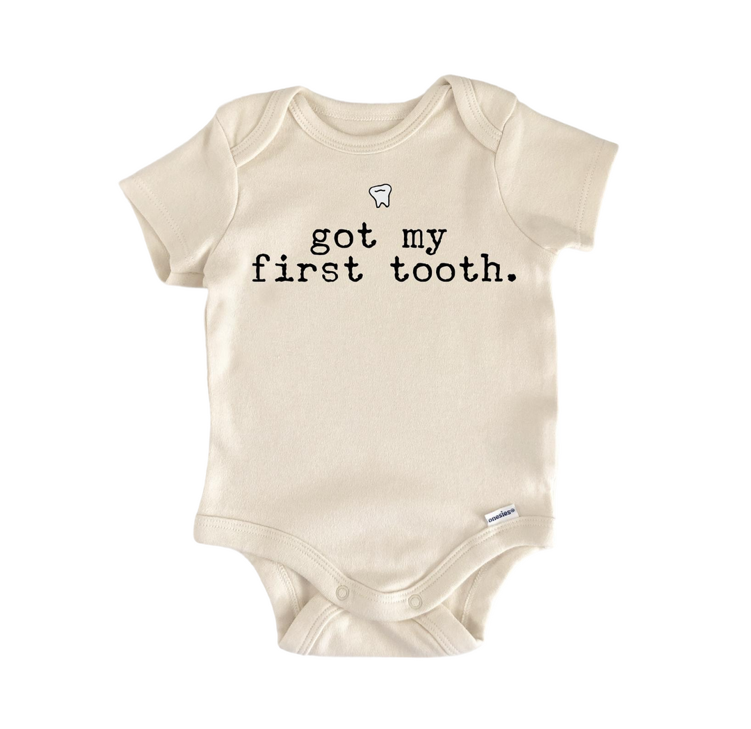 a baby bodysuit that says, got my first tooth
