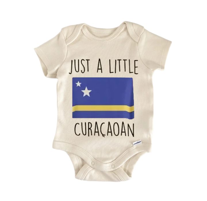 A beige baby onesie with a blue and yellow flag design and the text "Just a little CURACOAAN" printed on it.