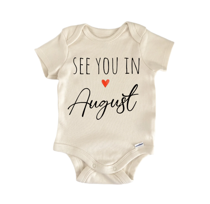 A beige baby onesie with the text "See you in August" printed on it.