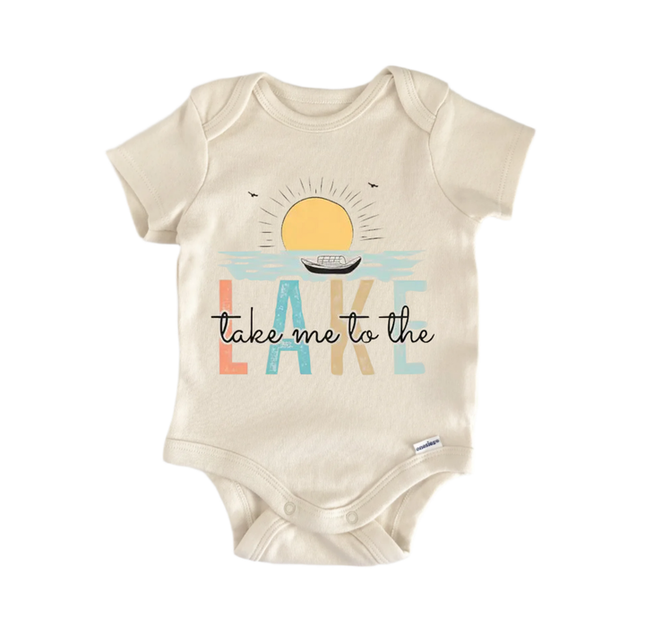 A baby onesie with a printed design on it, featuring a sun and a boat, along with the text "Take me to the lake".