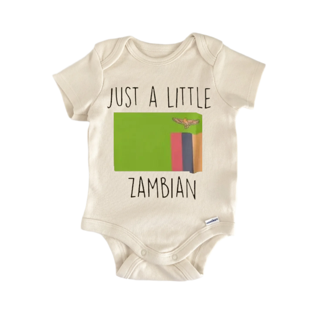 A baby onesie with the text "JUST A LITTLE ZAMBIAN" printed on it, along with a graphic of the Zimbabwean flag.