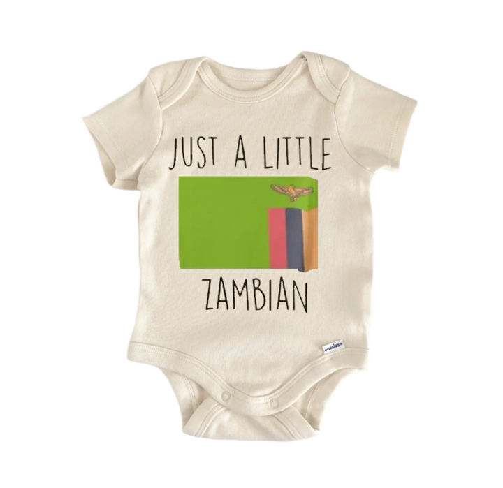 A baby onesie with the text "JUST A LITTLE ZAMBIAN" printed on it, along with a graphic of the Zimbabwean flag.