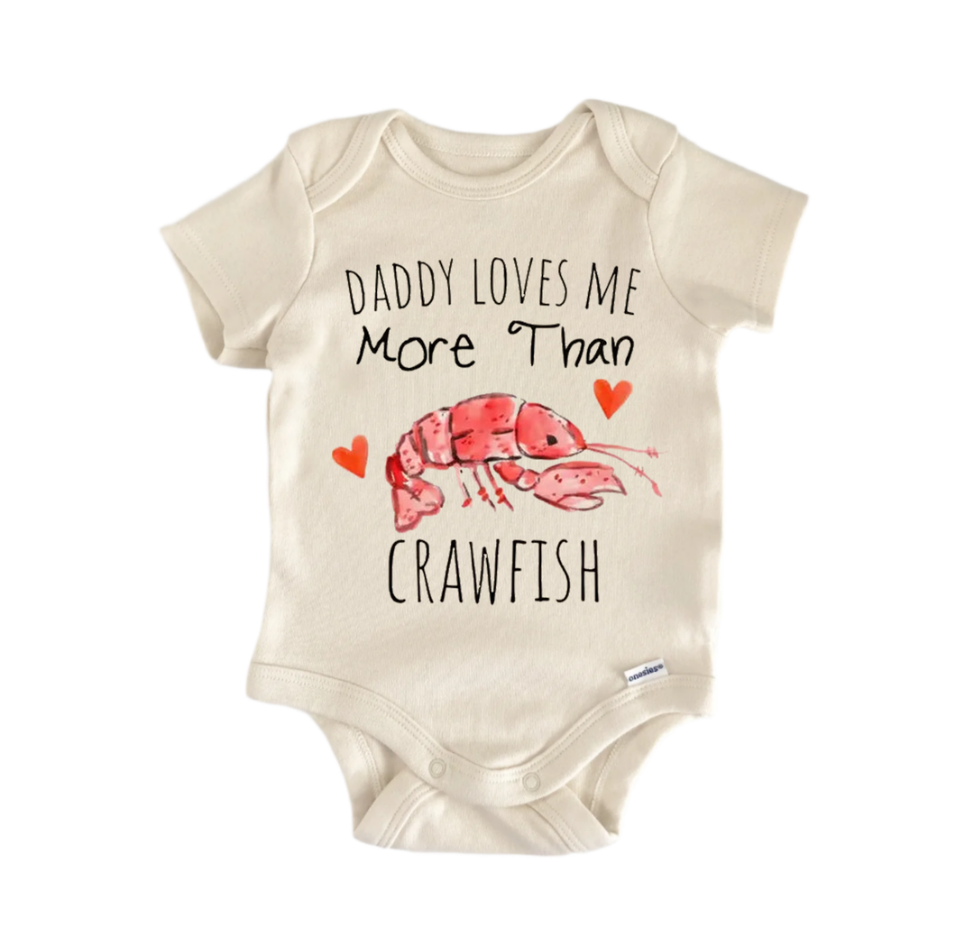 a baby onesie with a playful design and text that reads "DADMY LOVES ME MORE THAN CRAWFISH".