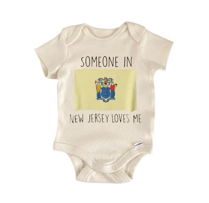 A beige baby onesie with a graphic of a state seal and the text "SOMEONE IN NEW JERSEY LOVES ME" printed on it.