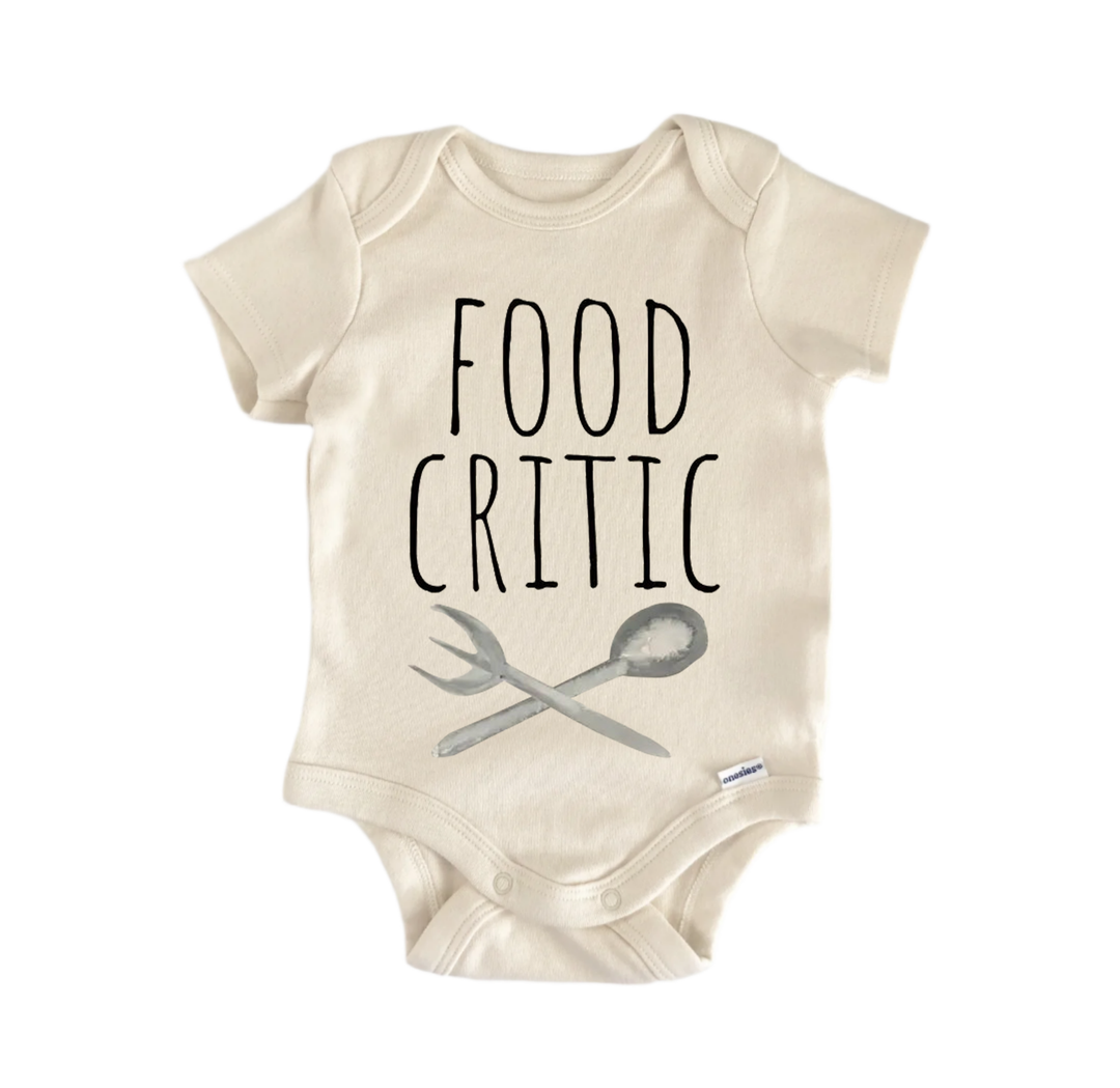 a baby onesie with the text "FOOD CRITIC" printed on it.