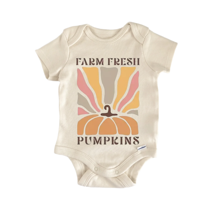 A beige baby onesie with a graphic design featuring a pumpkin and the text "FARM FRESH PUMPS" printed on it.