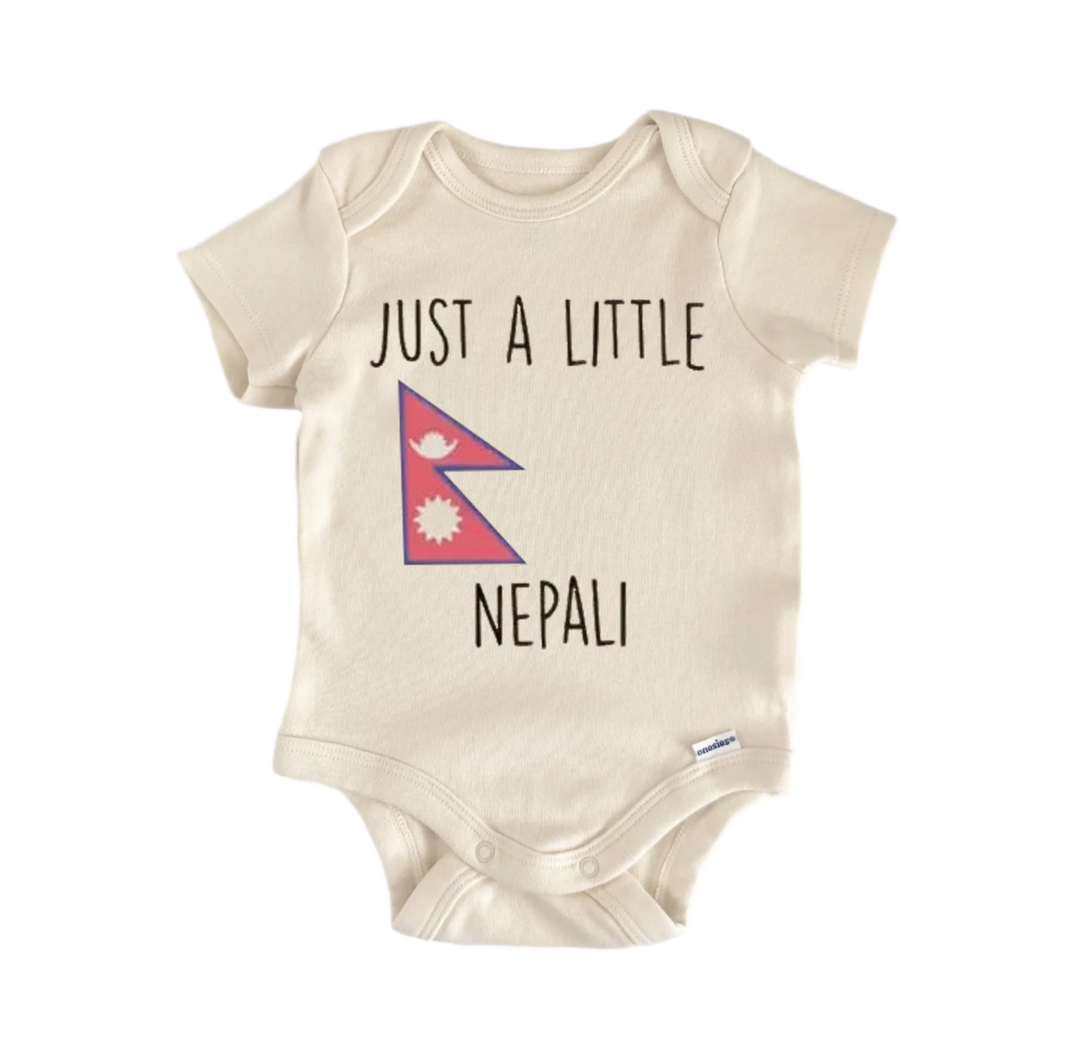 A beige baby onesie with the text "JUST A LITTLE NEPRALI" printed on it, along with a small Nepal flag design.